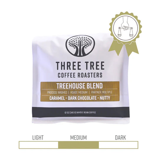 Three Tree Coffee Roaster Treehouse Blend 12 ounce bag with fair trade seal.